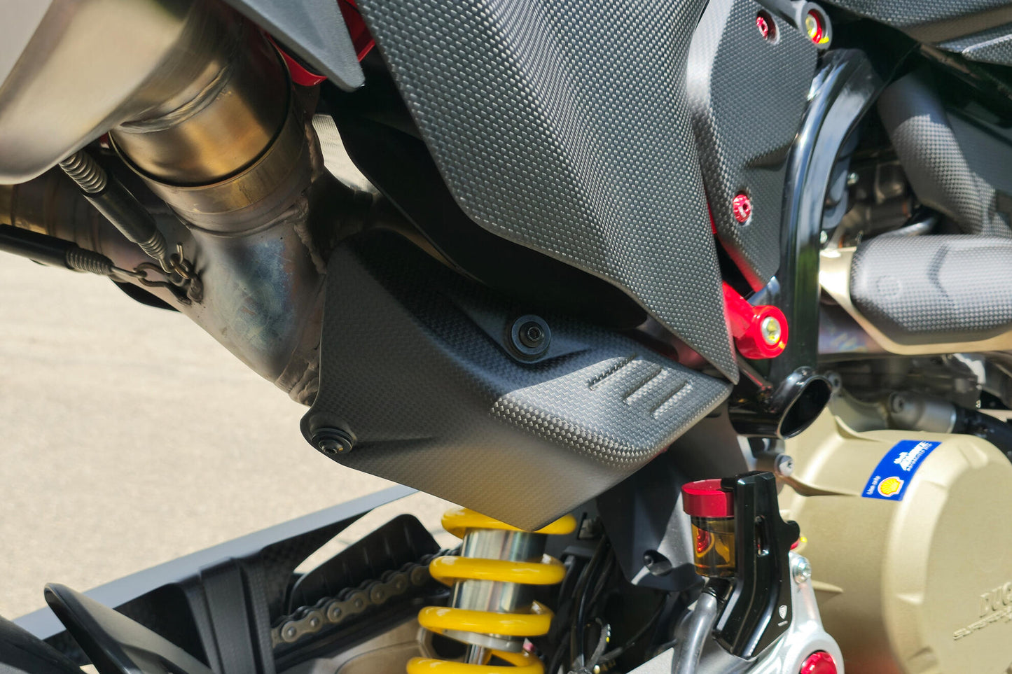 ZA276Y - CNC Racing Carbon Fiber Rear Exhaust Guard for the Ducati Hypermotard 698 Mono
